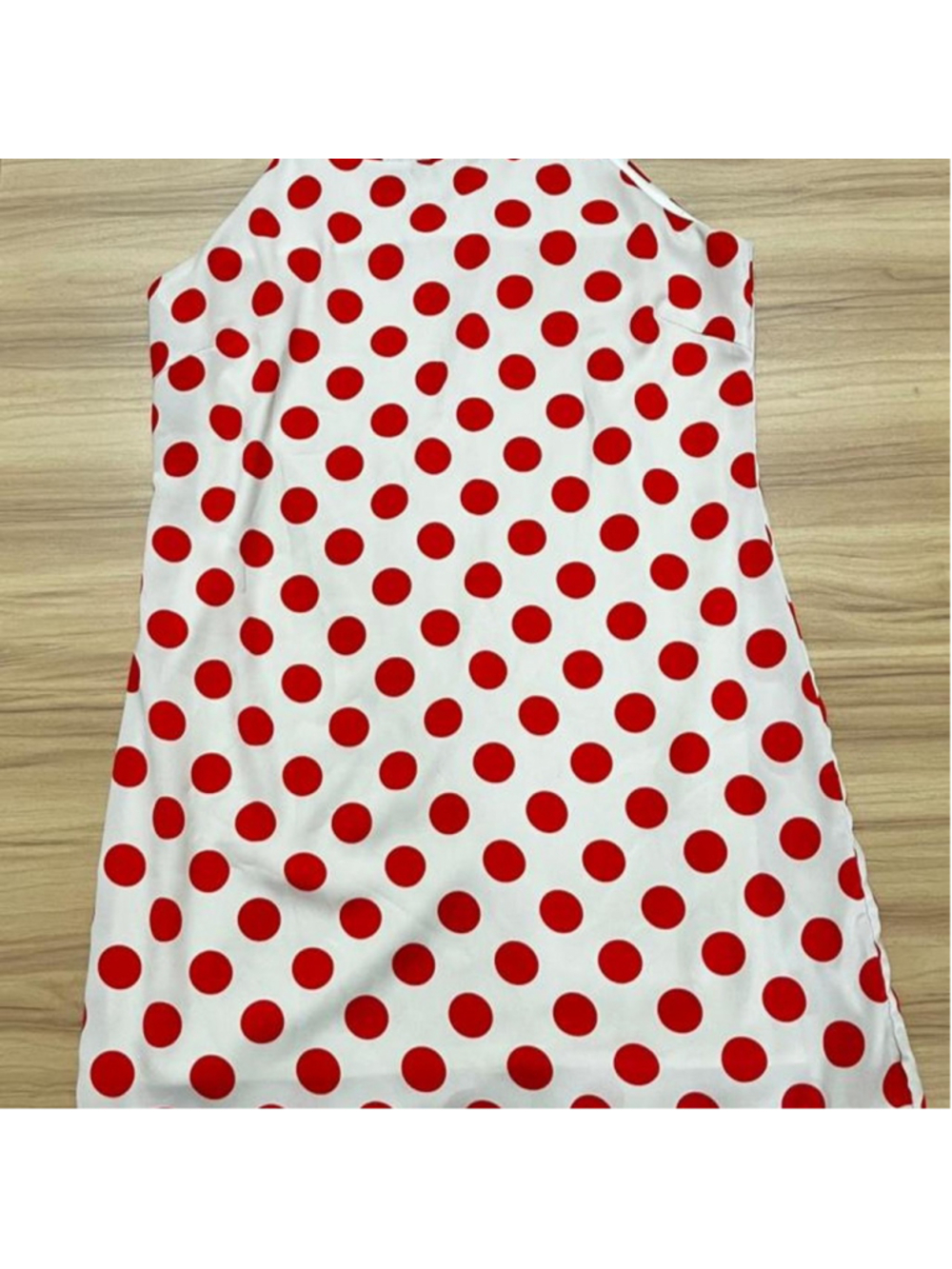 Pink Owl red and white polka dot mini shift dress with a high neckline and expos
